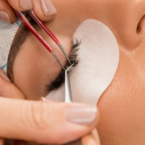Procedure of eyelashes extension in beauty salon